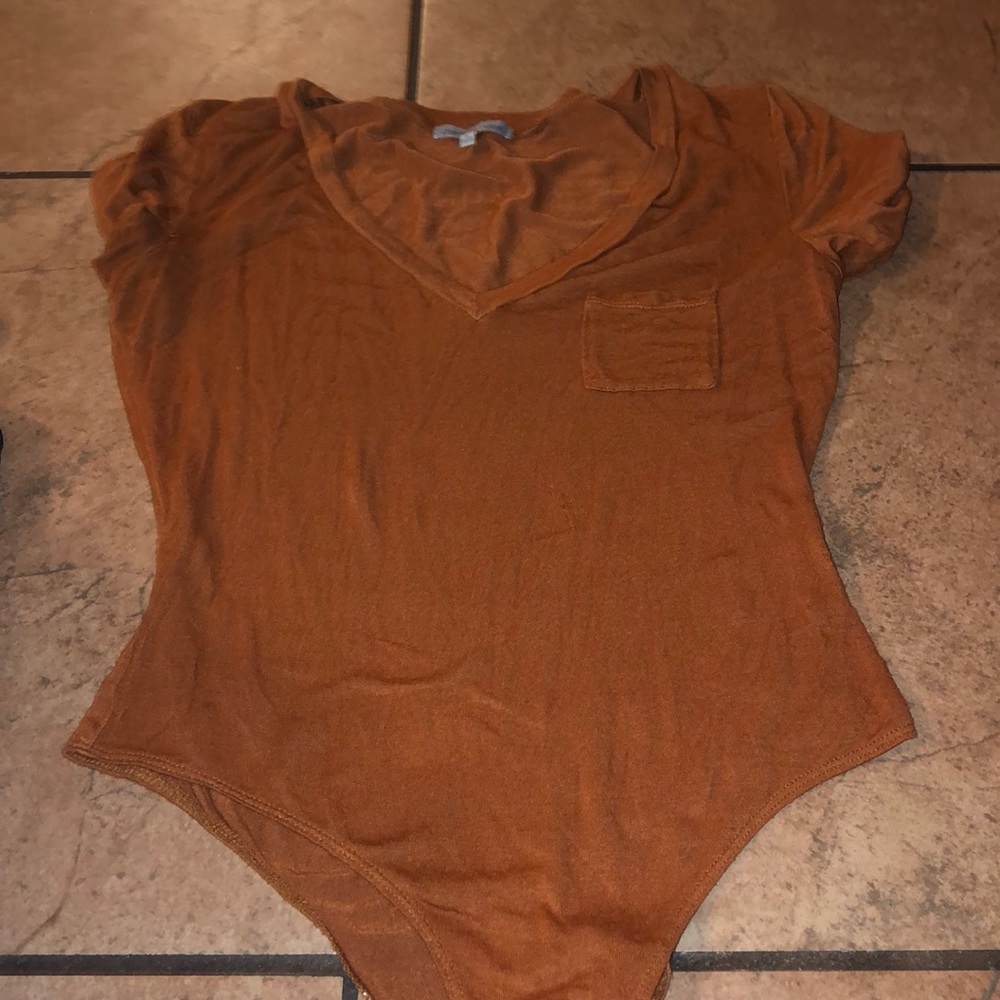 Burnt orange tee shirt, v neck with pocket
